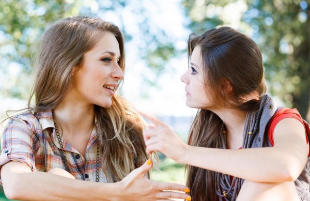 two-young-females-talking-to-each-other